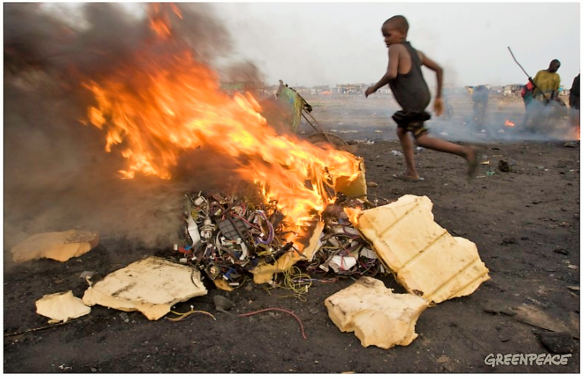 Boys burning electronic cables and other electrical components in order to melt off the plastic and reclaim the copper wiring. This burning in small fires releases toxic chemicals into the environment. Source: GREENPEACE (2008)
