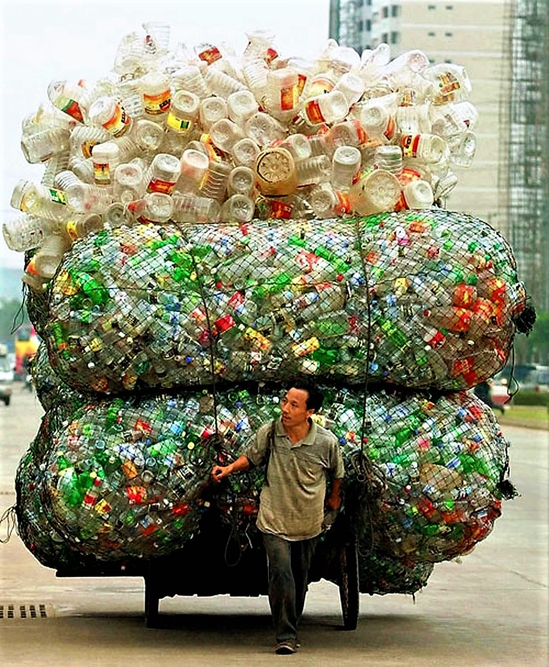 Man transporting empty plastic bottles, China. Source: NATIONALGEOGRAPHICS (2003) 