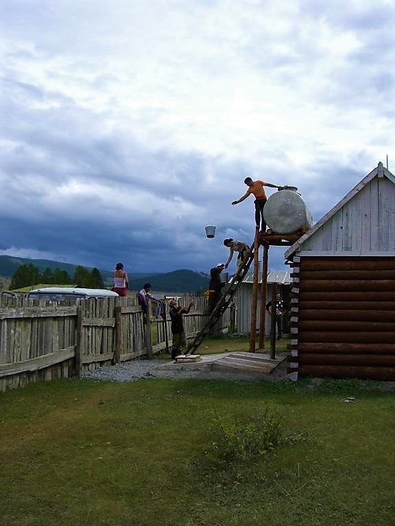 Non-piped water supply takes a lot of time every day. A water tank for a shower house in a tourist area in Mongolia is filled. Source: CONRADIN (2007)