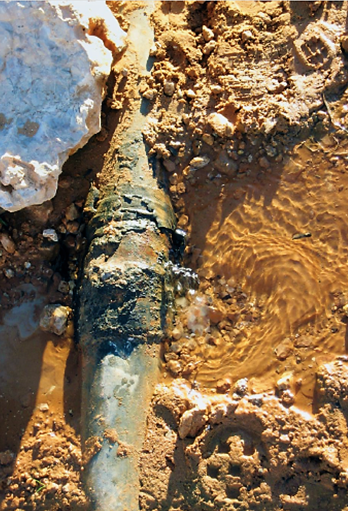 A damaged pipe causing water loss. Source: GIZ (2011) 